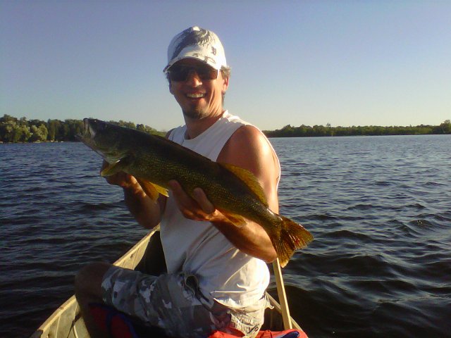 walleye 1..jpg - Aaron with a Walleye released for another angler to catch on another day.